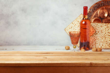 Empty modern wooden table over Passover celebration  background. Pesah mock up for design and...