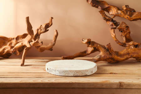 Empty wooden log on table over modern creative background. Cosmetics mock up for design and product displayの写真素材
