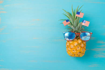 4th of July  creative concept with pineapple and American flag. Happy Independence Day background....