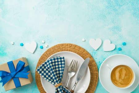 Father's day brunch background with coffee cup, plate  and gift box. Flat lay composition, top viewの写真素材
