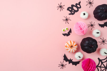 Happy Halloween holiday concept. Glitter black pumpkin and party decorations on pink background. Top view, flat layの写真素材