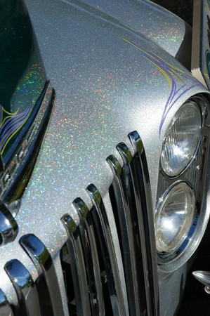 A front section of a hotrod specially painted in multi colored metallic paint.の写真素材