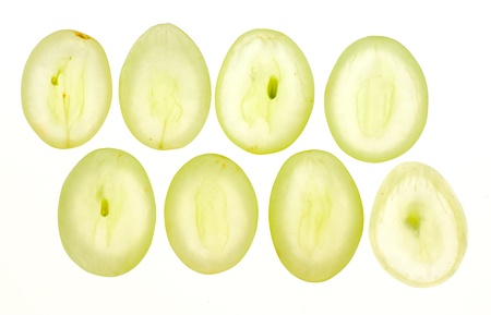 Thinly sliced pieces of white grapes lit from behindの写真素材