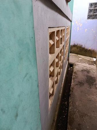 Wooden shelves on the wall of an old abandoned building in the city