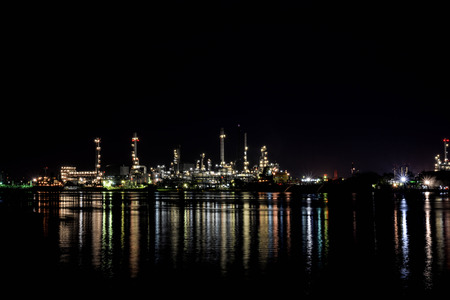 Light of oil refinery reflecting on the surface