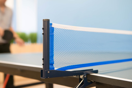 Table tennis nets and playerの写真素材