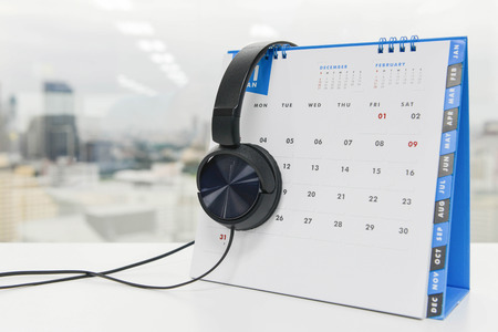 Black Over Ear Headphones on the white calendarの写真素材