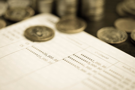 Coin on book bank account for financial conceptの写真素材