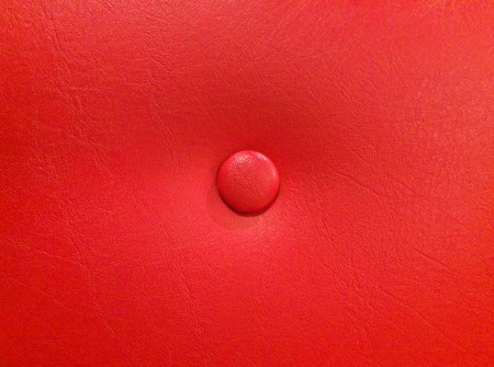 Texture of red leather sofa with studsの写真素材