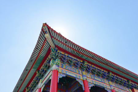 The Chinese temple roof under blue skyの写真素材