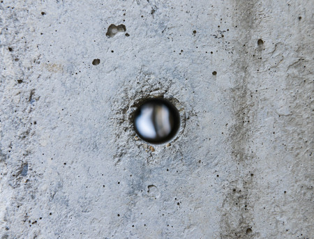 Hole in the concrete from electricity postの写真素材