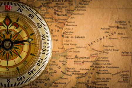 Close up compass on the vintage map