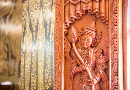 Wooden window with Thai carving in Buddhist templeのeditorial素材
