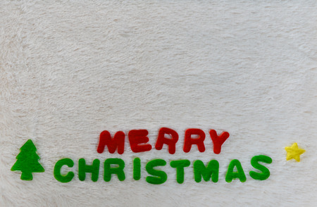 erry Christmas wording on wool background with copy spaceの写真素材
