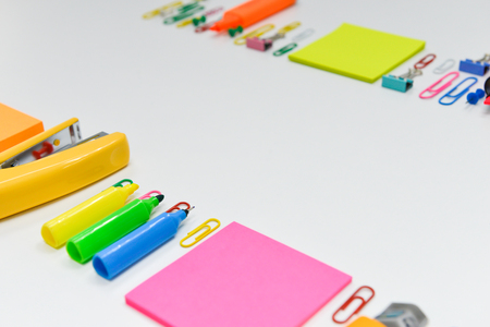Office or school stationary including paper note, paperclip, and highlighter with copy spaceの写真素材