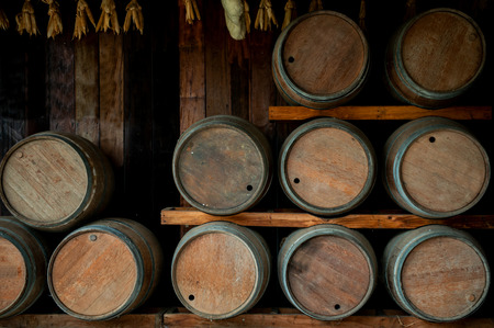 Wine barrels are lined up on shelve