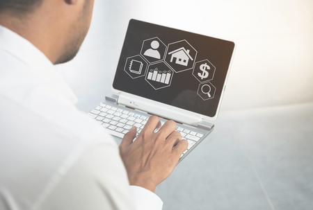 Man is using the laptop with business icon for marketing conceptの写真素材