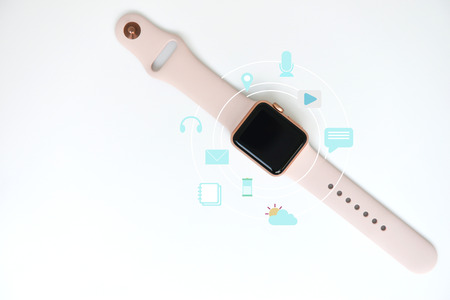 Pink woman smart watch with media icon on the white for watch technology conceptの写真素材