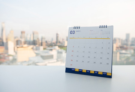 Calendar of March on the white table with city view backgroundの写真素材