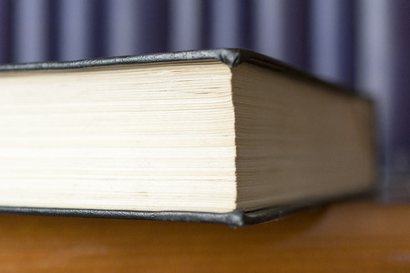 Books on a shelf in home library.の写真素材