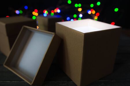 A mysterious glowing gift in a box, concept.