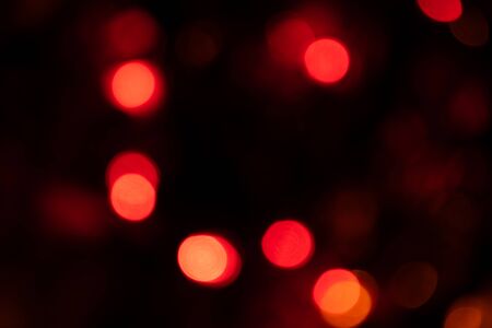 background image, colored round lights in the dark, for Christmas cards and greetings. Degradation