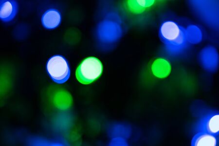 background image, colored round lights in the dark, for Christmas cards and greetings. Degradationの写真素材