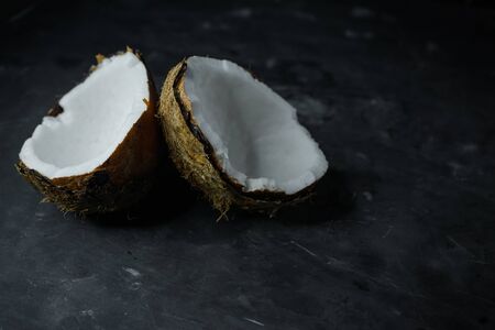 selective focus, natural coconut on dark background