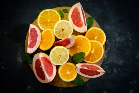 selective focus, citrus fruit on dark backgroundの写真素材