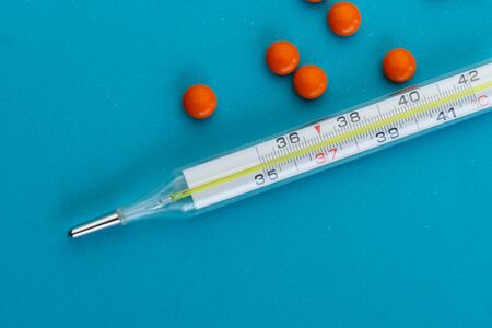 selective focus, mercury thermometer with temperature, with virus tablets, medicine