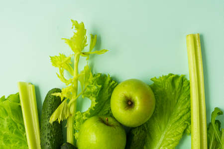selective focus, detox nutrition, green diet on vegetables and fruits. natural products on a blue...