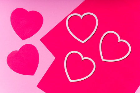 colored paper hearts, greeting card for Valentine's day. copyspace. with your own hands