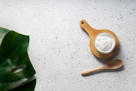 selective focus. Collagen powder in a glass container. light background. copyspace. Extra protein intake. Natural beauty and Health supplement for skin, bones, joints and intestinesの写真素材