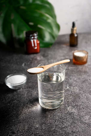 selective focus. Collagen powder in a glass container. light background. copyspace. Extra protein intake. Natural beauty and Health supplement for skin, bones, joints and intestinesの写真素材