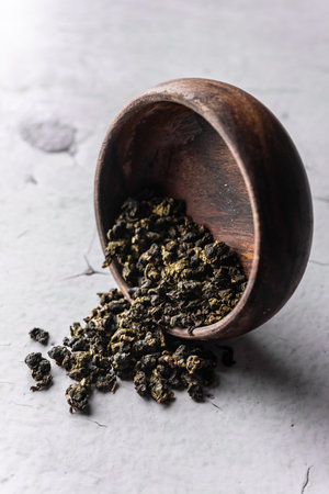 selective focus, natural green leaf tea in a wood bowlの写真素材