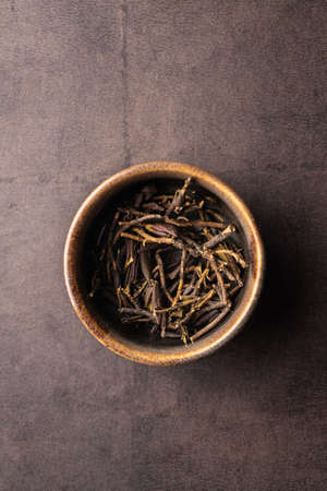 selective focus, natural green leaf tea in a clay bowlの写真素材