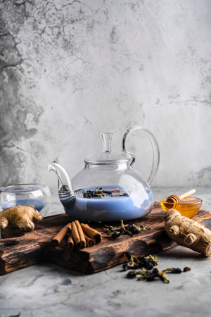 selective focus, freshly brewed blue masala tea in a transparent teapotの写真素材