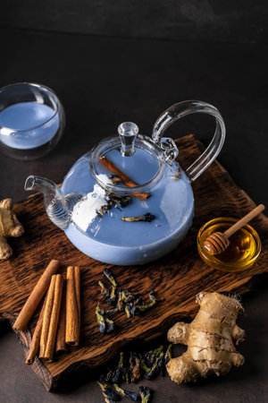 selective focus, freshly brewed blue masala tea in a transparent teapotの写真素材