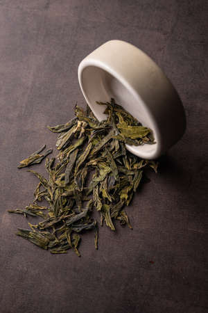 selective focus, natural green leaf tea in a clay bowlの写真素材