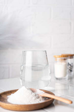 selective focus. food supplement collagen in the form of powder for dissolving in water. natural composition. benefits for the face and bodyの写真素材