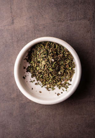 selective focus, natural green leaf tea in a clay bowlの写真素材