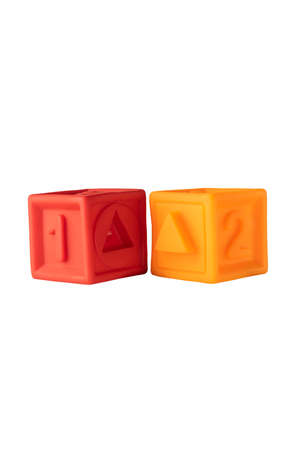 children's rubber cubes. a soft toy. develops motor skills of fingers and hands. colored cubes with numbers and drawings for memorization. on a white backgroundの写真素材
