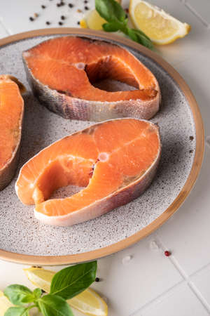 raw trout steak before cookingの写真素材