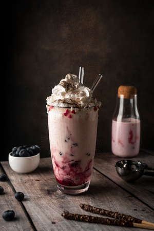 berry milkshake with cream and cocoaの写真素材