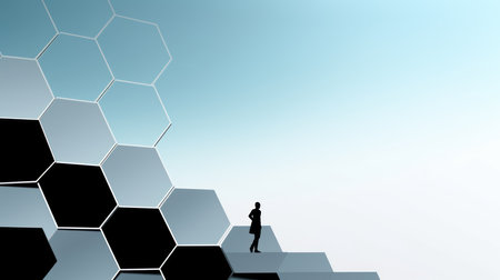 Silhouette of businesswoman standing on a wall of hexagonsの素材