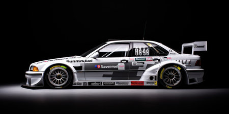 Racing car on a black background, studio shot, close-upの素材