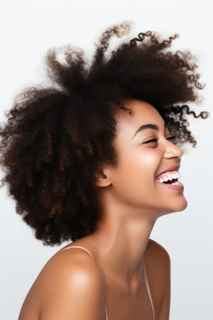 Beautiful african american woman with afro hairstyle on white backgroundの素材