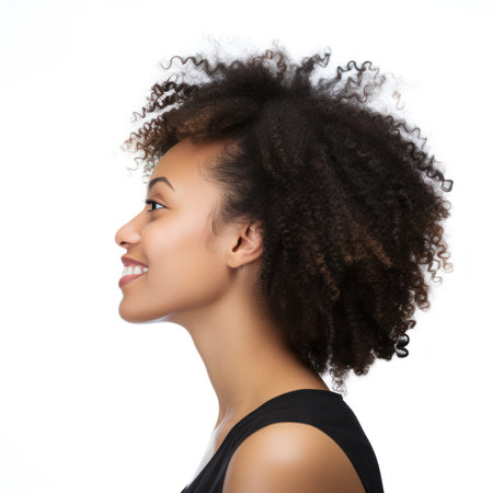Beautiful african american woman with afro hairstyle on white backgroundの素材