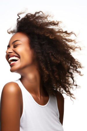 Beautiful african american woman with curly hair on white backgroundの素材