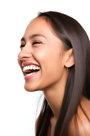 Portrait of a beautiful young asian woman smiling isolated on white backgroundの素材